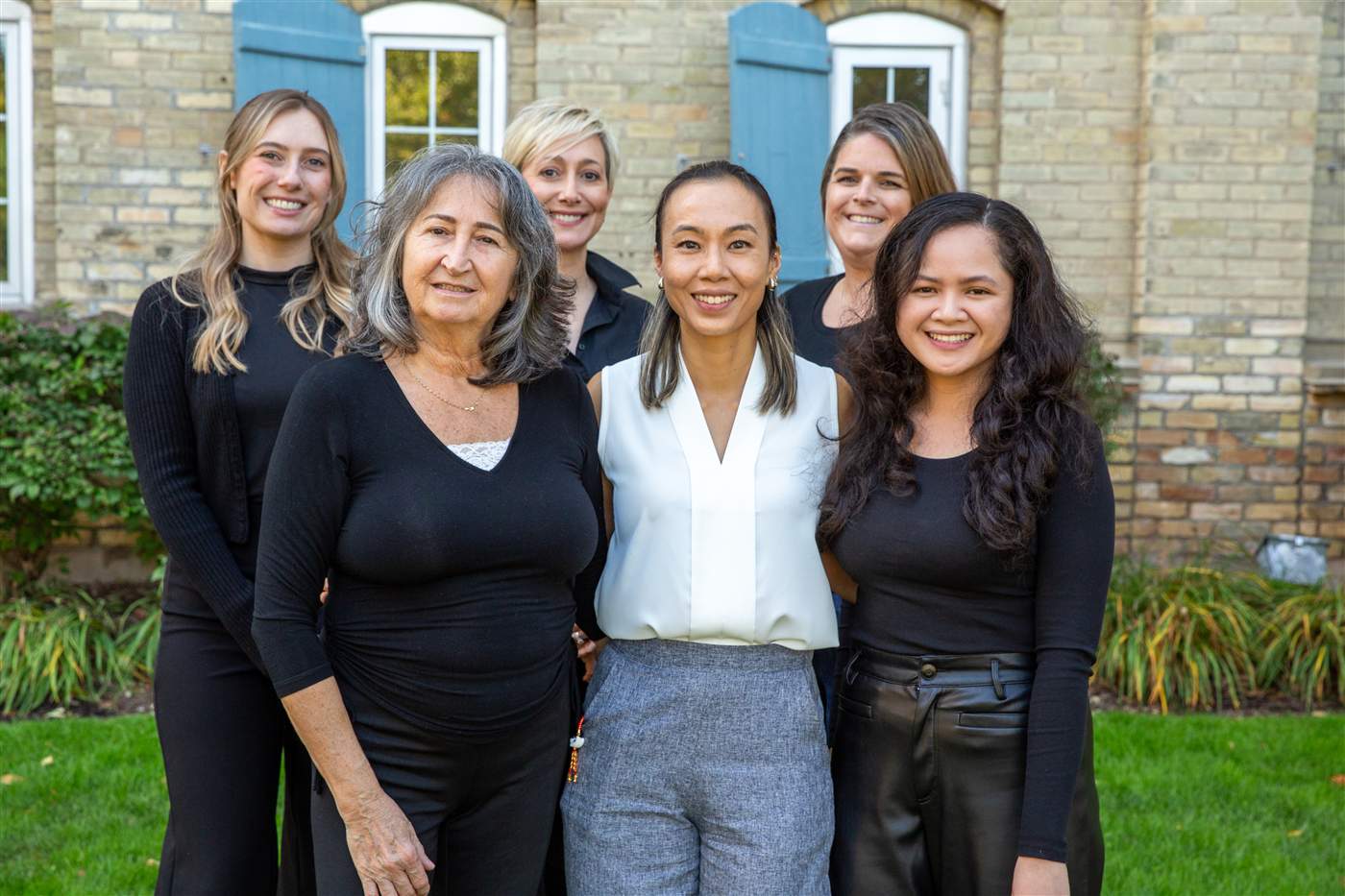 The Chiu Dental team on the lawn outside the practice